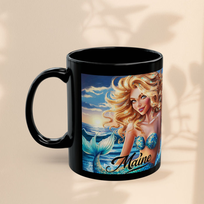 Black mug with mermaid ocean scene artwork and 'Maine' script