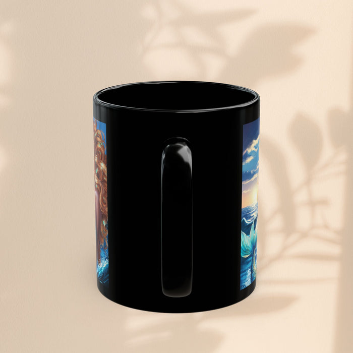 Black mug with mermaid and ocean artwork partially visible, side view