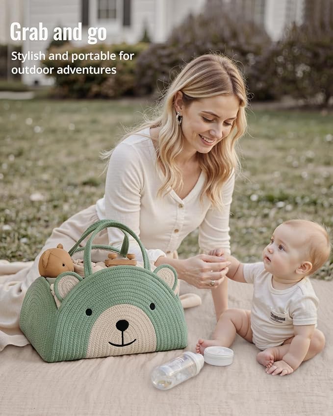 Green bear diaper caddy basket with rope handles set on outdoor blanket