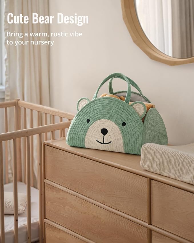 Green bear diaper caddy basket with rope handles on nursery dresser