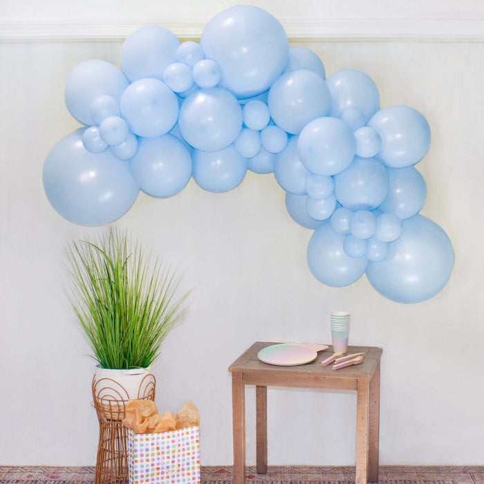 Blue balloon garland arch made of light-blue balloon clusters