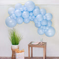 Blue balloon garland arch made of light-blue balloon clusters