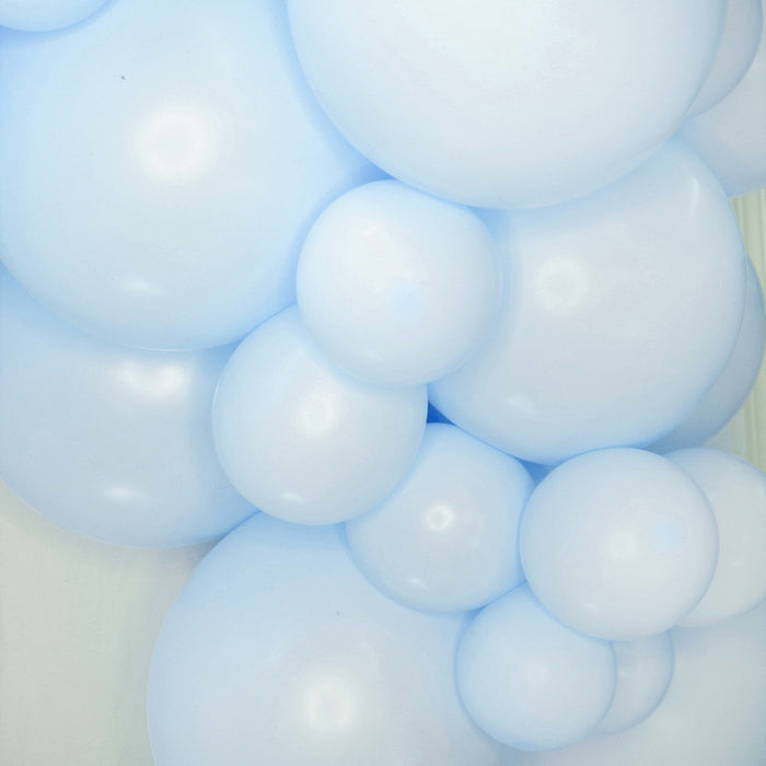 Light blue balloon cluster close-up with glossy round balloons