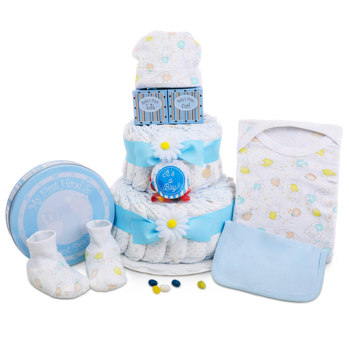 Two-tier diaper cake gift basket with blue ribbon, cap, bib, and round keepsake tin