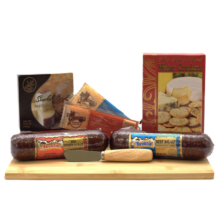 Wood cutting board gift set with salami rolls, cheese packs, and water crackers box