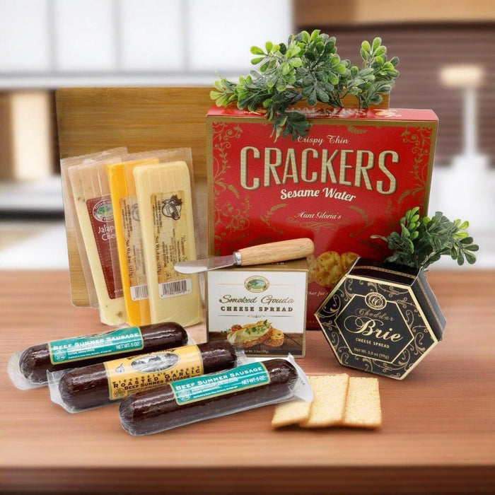 Wooden cutting board gift set with crackers box, cheese spreads, and stacked crackers