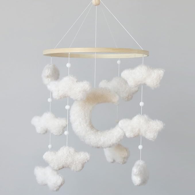 Boho crib moon mobile with white plush clouds and dangling bead strings