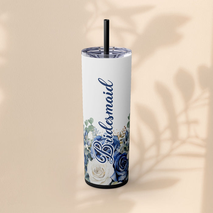 20oz skinny tumbler with blue “Bridesmaid” script and blue/white floral roses
