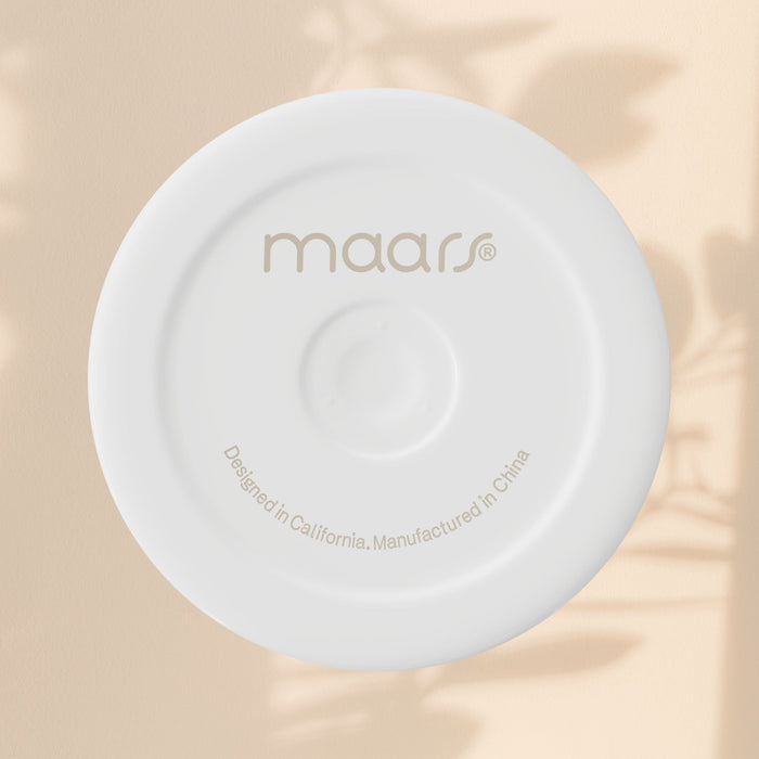 White tumbler lid top with “maars” logo and “Designed in California” text