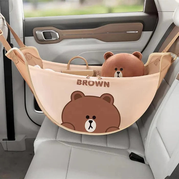 Light brown car seat storage bag with bear face graphic and hanging straps
