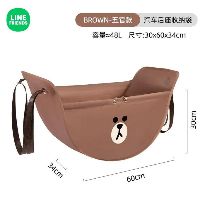 Brown car seat storage bag with bear emblem, strap handles, and dimension labels