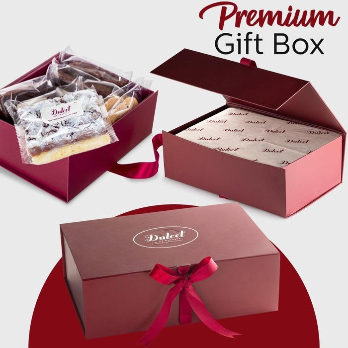 Premium gift box with tissue-wrapped dessert and satin ribbon on lid