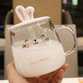 Glass bunny mug with handle, bunny-ear lid, and cute face print