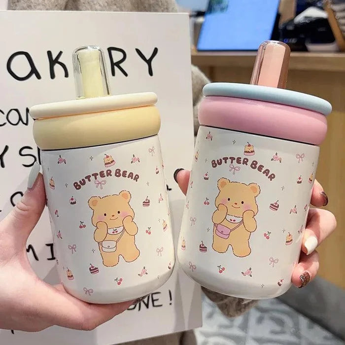 Two Butter Bear thermos cups, cream and pink lids, white bear prints