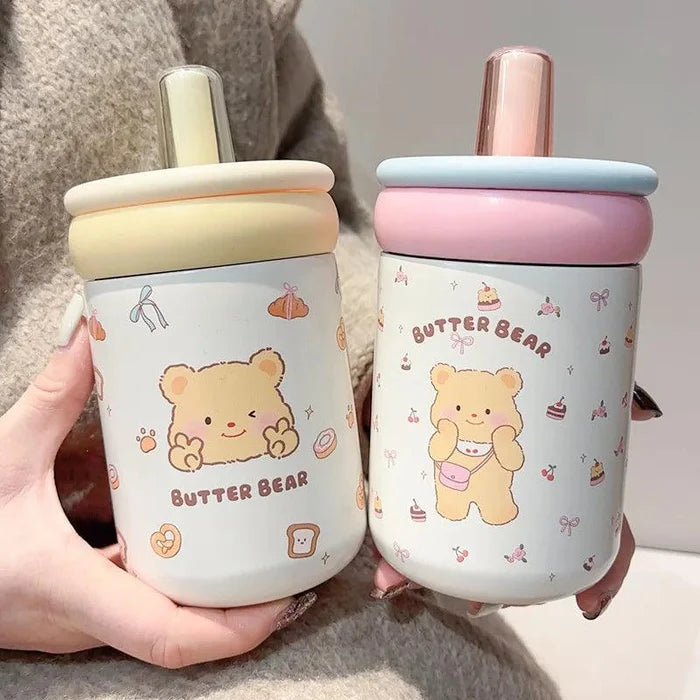 Two Butter Bear thermos cups with pale yellow and light blue/pink lids, white bear prints