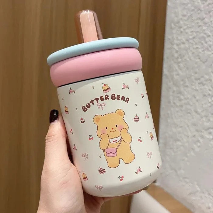 Butter Bear thermos cup with light blue lid, clear straw, white body with bear illustration