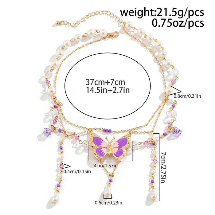 Gold multi-layer pearl necklace with butterfly charm and pink bead tassel drops