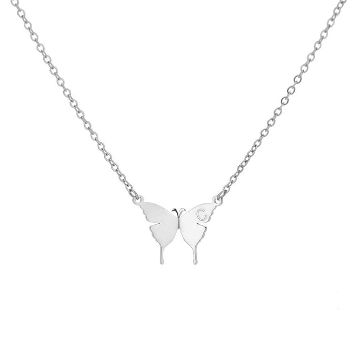 Silver-tone butterfly initial letter necklace with two butterfly charms on a chain