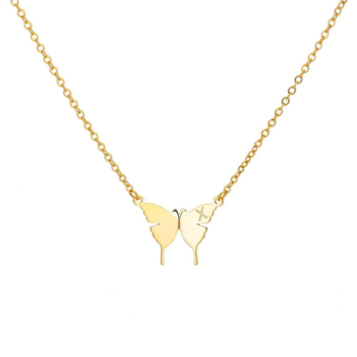 X / Gold Tone