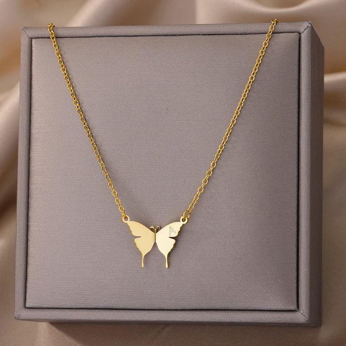 Gold-tone butterfly initial letter necklace with two butterfly charms