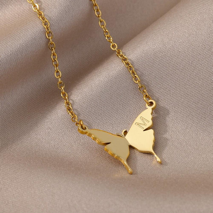 Gold-tone butterfly initial letter necklace with butterfly charms and letter M