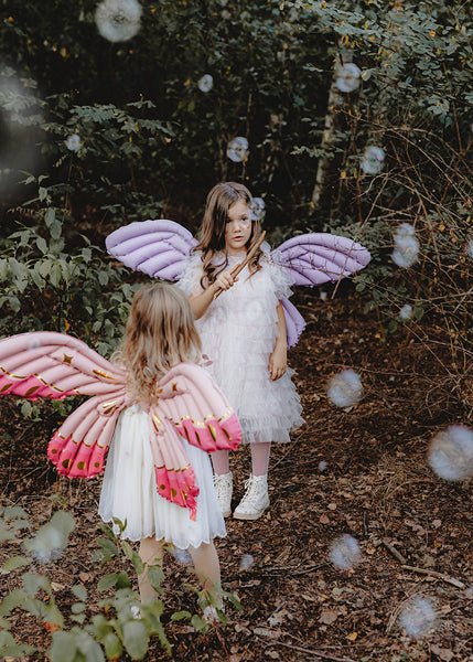 Purple butterfly wings wearable balloon costume on a child, with padded wing sections