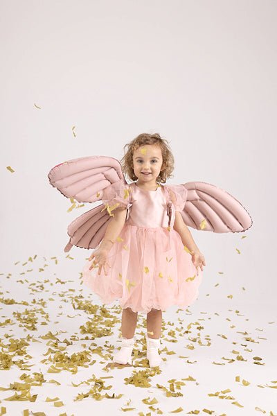 Pink butterfly wings wearable balloon costume on a child, with ribbon straps at the back