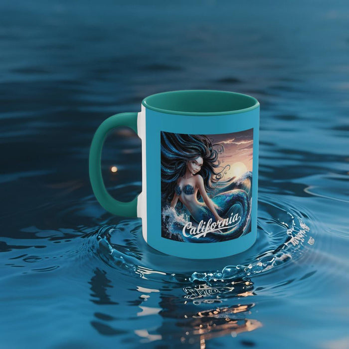 Teal accent mug with mermaid and “California” graphic, splashing water scene