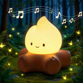 Warm yellow teardrop night light on brown base with cute smile face
