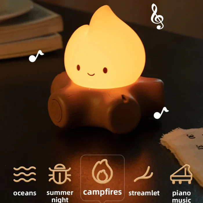 Glowing teardrop night light resting on brown rounded base