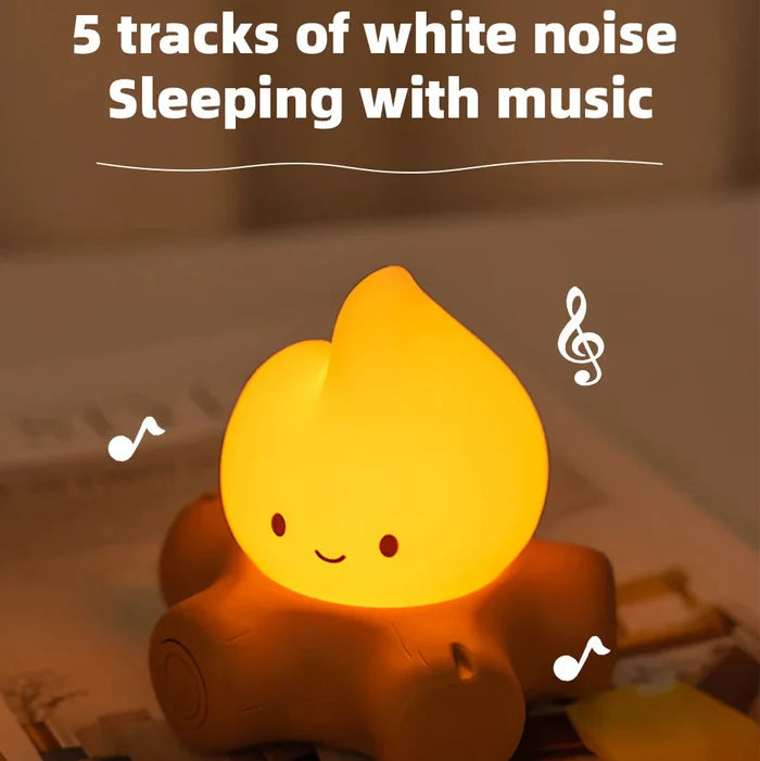 Warm yellow teardrop night light with smile on brown log-shaped base