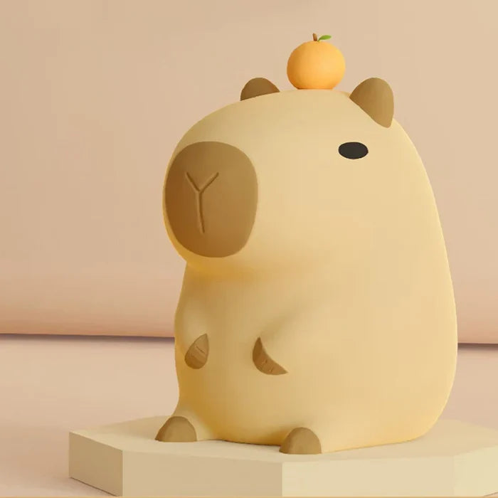 Capybara night light with orange-capped head, oval face and rounded ears