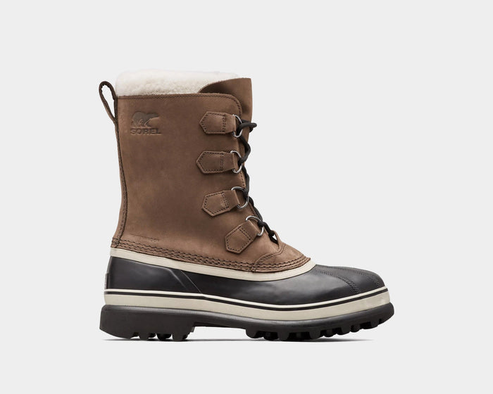 Sorel Caribou Winter Boots in brown suede with waterproof black rubber lower and shearling lining, side view.