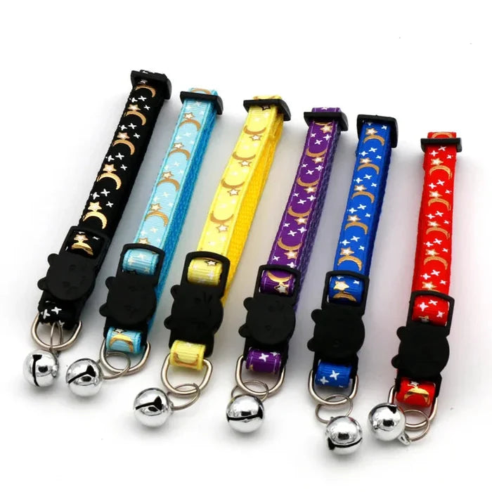 Adjustable cat collars with bell and star-moon print, assorted colors on display
