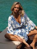 Model wearing the Celia dress in La Mer print by NAIA Beach