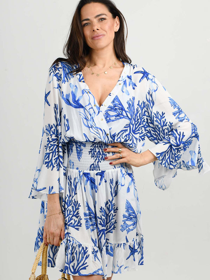 Model wearing the Celia dress in La Mer print by NAIA Beach