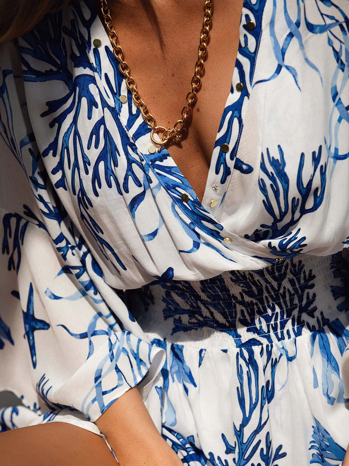 Model wearing the Celia dress in La Mer print by NAIA Beach