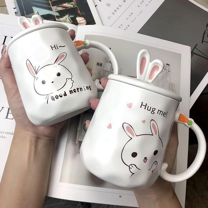 White ceramic bunny mug: 'Good morning' rabbit face with pink ears.