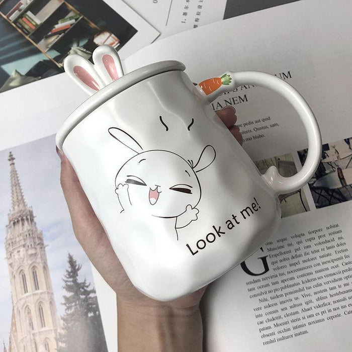 White ceramic bunny mug: 'Look at me!' rabbit face with pink ears.