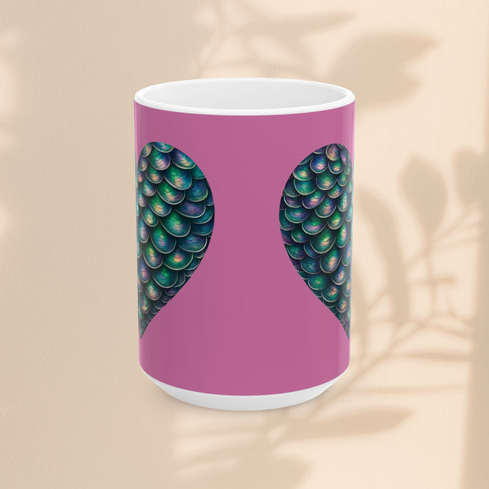 White ceramic mug with purple center and green mermaid scale heart wings design