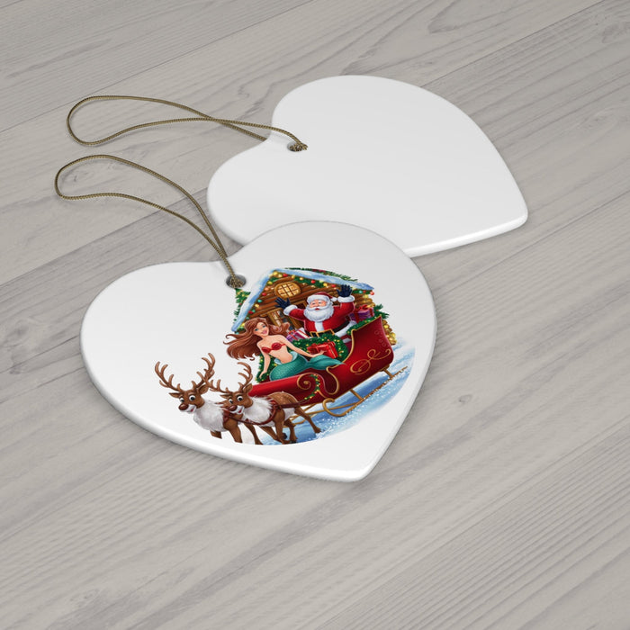 Heart-shaped ceramic ornament featuring mermaid, Santa, and reindeer sleigh, hanging on cords