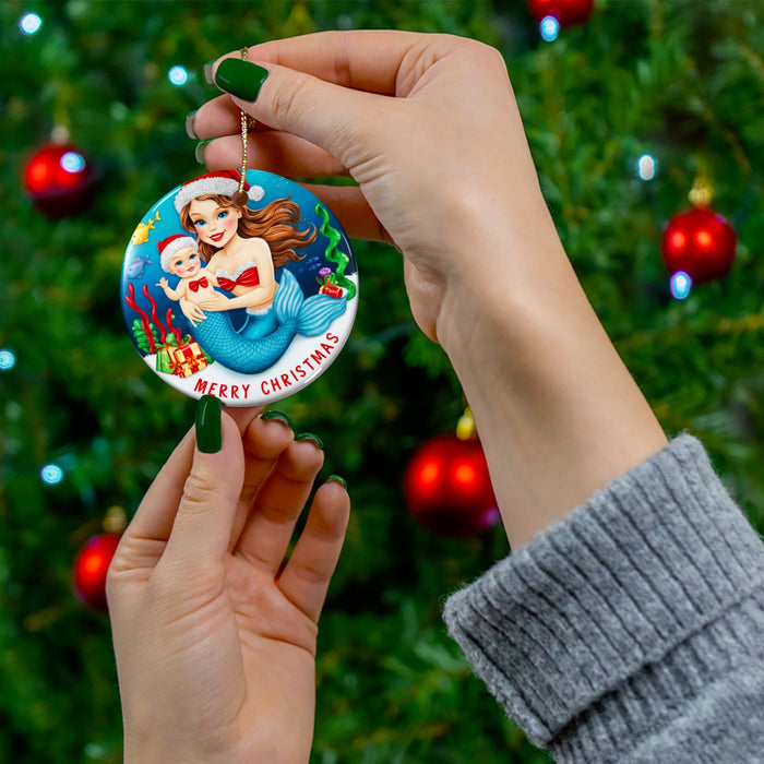 Mermaid mom ceramic ornament with baby, 'Merry Christmas' lettering, held on gold string