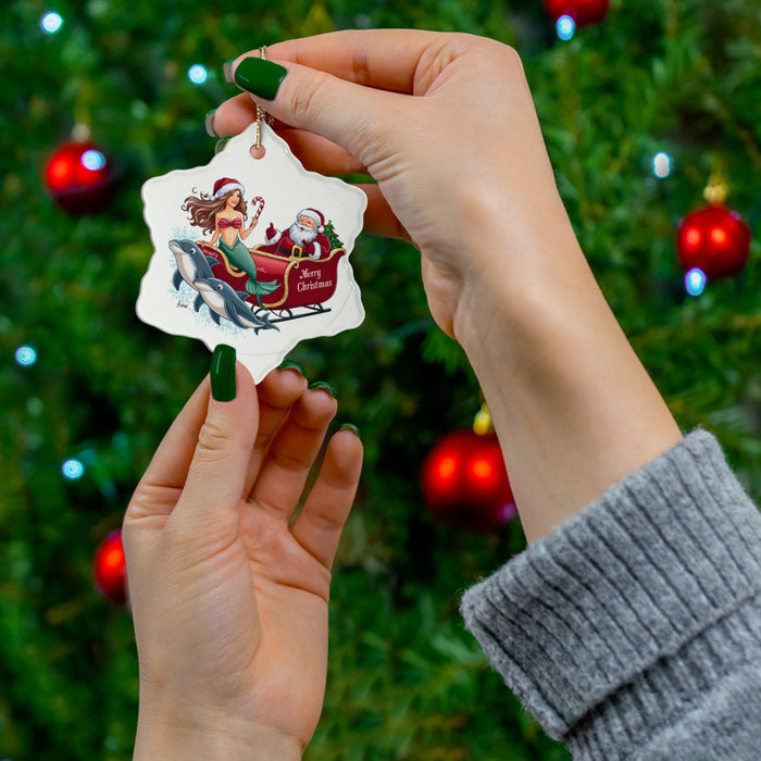 Handheld round ceramic ornament with mermaid and Santa on dolphins; gold loop for hanging