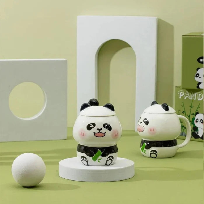 Ceramic panda mug with lid and handle; white mug with black belt and green bamboo accents