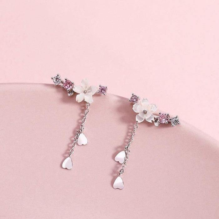 Cherry blossom drop charm earrings, silver with pink and white flower motifs and dangling charms