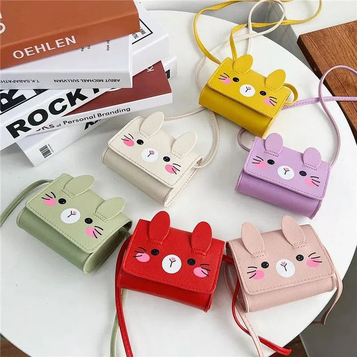 Bunny-themed crossbody bag assortment in white, pink, green, yellow, and red