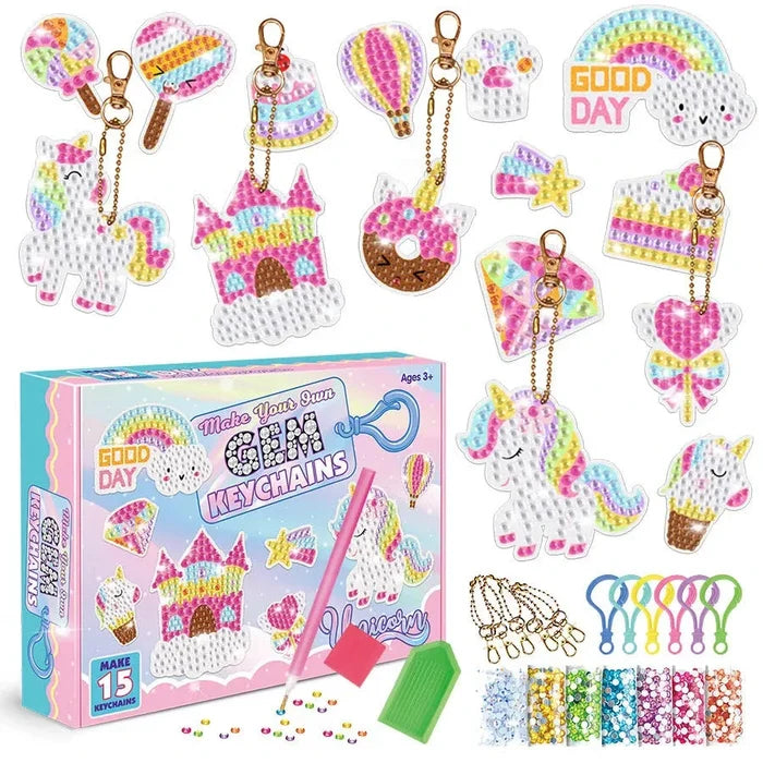 Diamond painting keychain kit set with assorted unicorn, cake, star, and heart charms plus tools.
