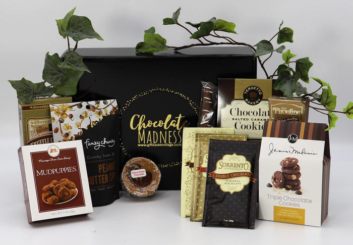 Chocolate gift box with assorted cookies and caramels in a black tray