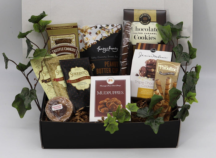 Assorted chocolate cookies gift box in black tray with multiple snack packages