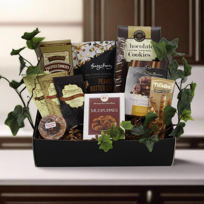 Chocolate gift box with assorted cookie and candy packages in a black tray
